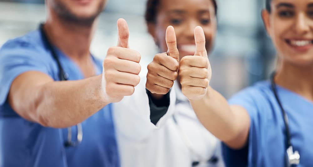 Doctors, nurses or thumbs up hands in success